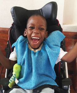 Brandon - Sophie's Place, boy in a wheelchair with a big smile