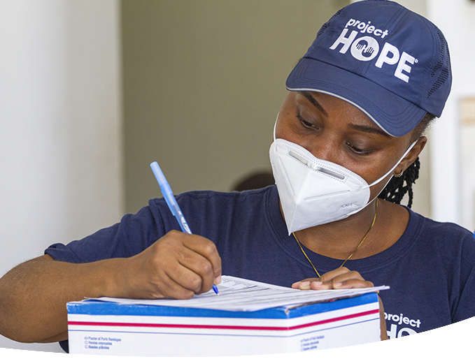 Woman writing note.