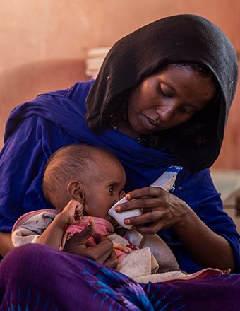 Farah, 27, Aliya, 8 mos, who spent three days in a  ward for severely malnourished children in Ethiopia